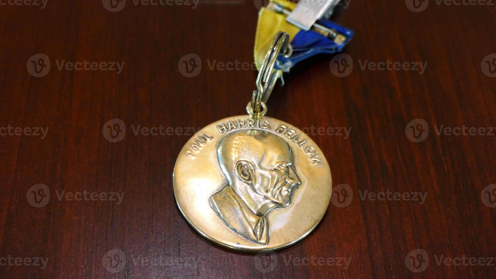shot of a medal with a portrait of a man on it photo