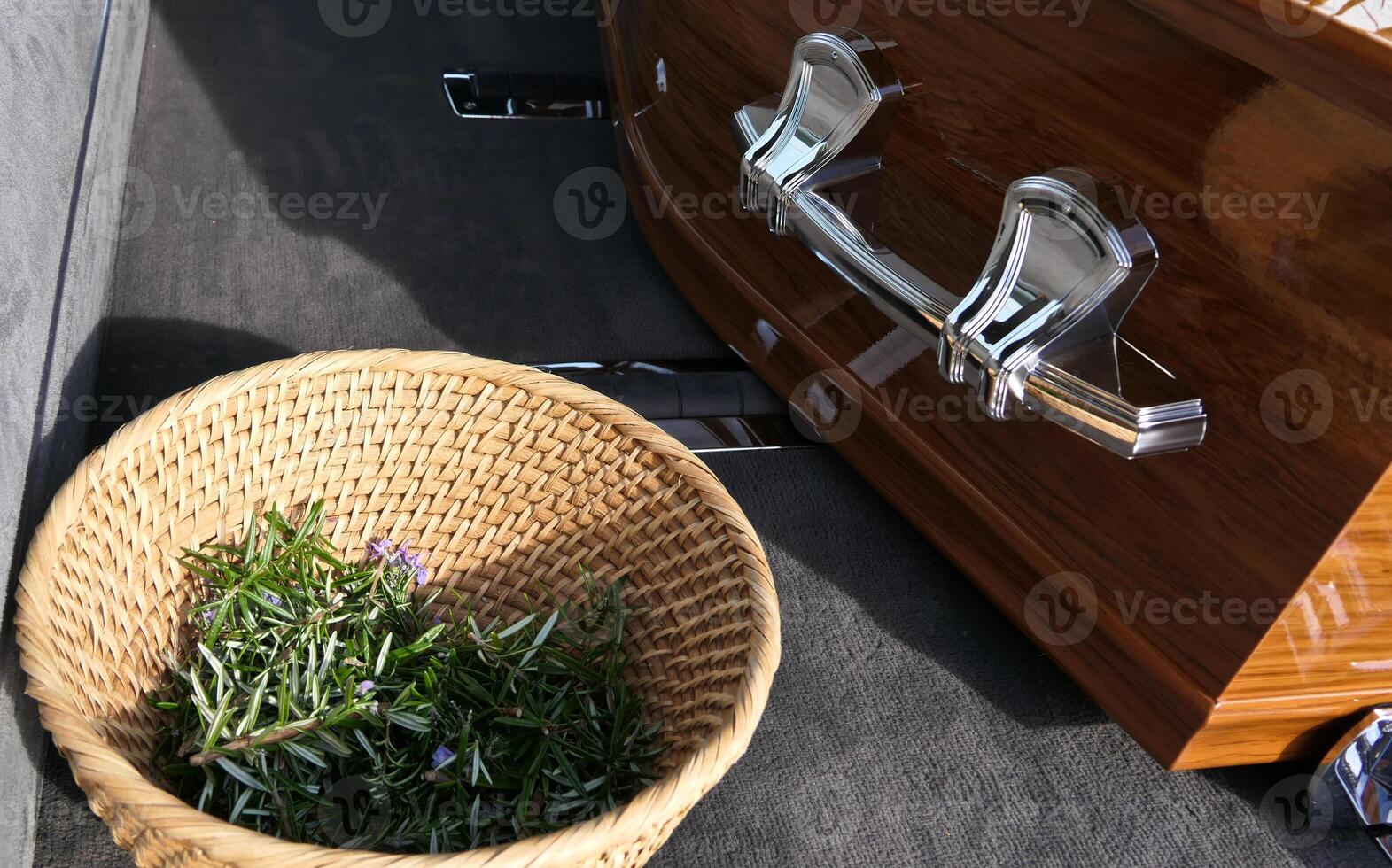 a basket of herbs sitting next to a wooden casket photo
