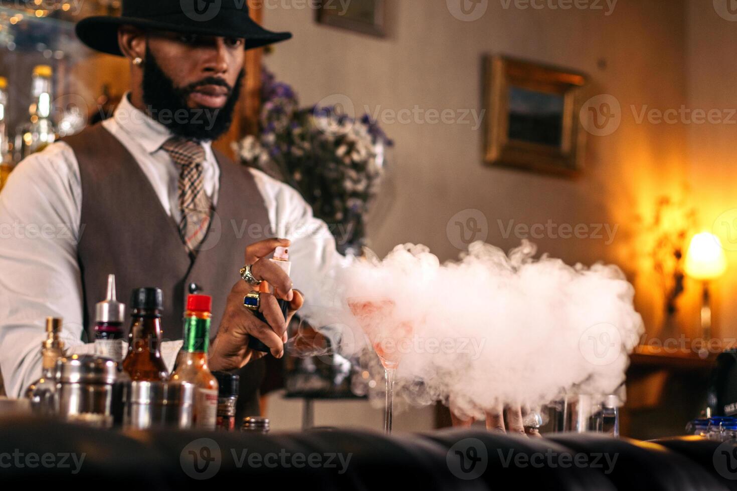 Signature cocktails a creative bartender at his bar. Coctail preparation photo