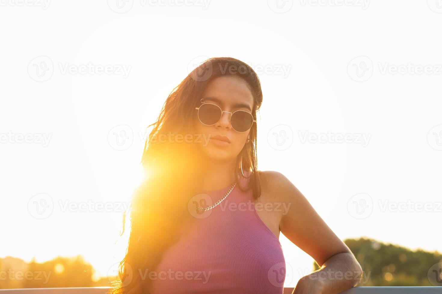 Close up of a young stylish latina woman looking at the camera photo