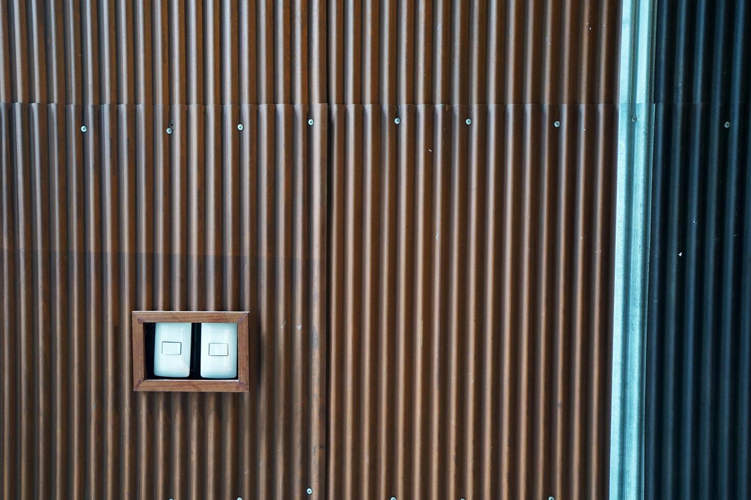 Wooden Lighting switch box decorated in metal zinc sheet wall photo