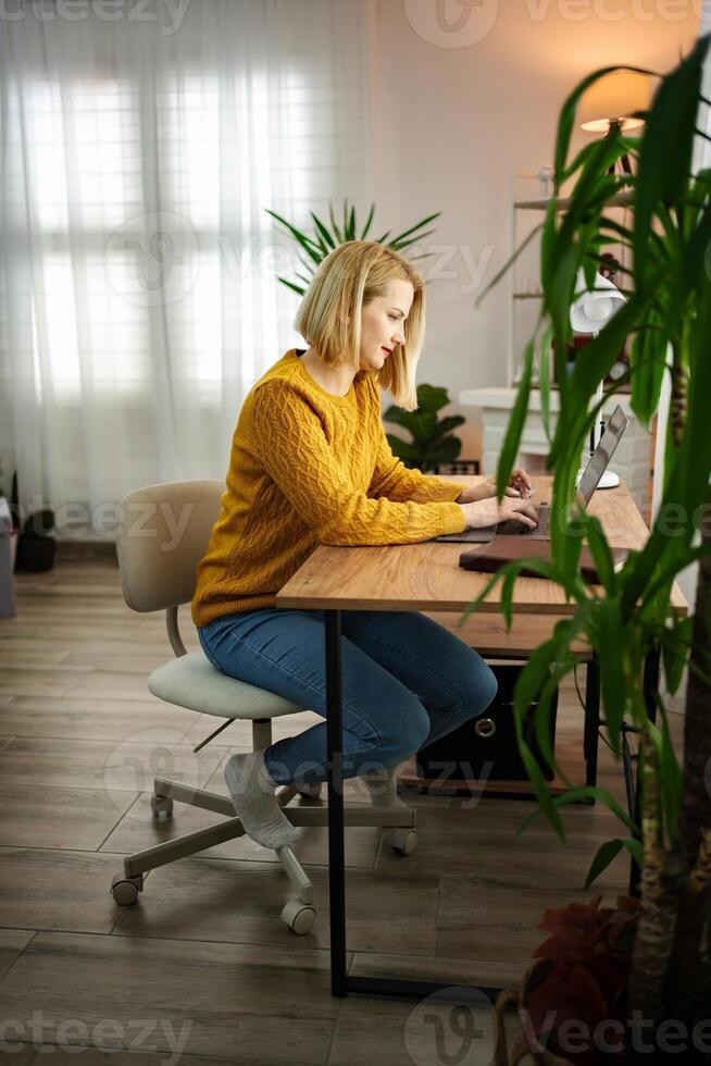Working in a cozy home office while enjoying natural light and a comfortable atmosphere photo