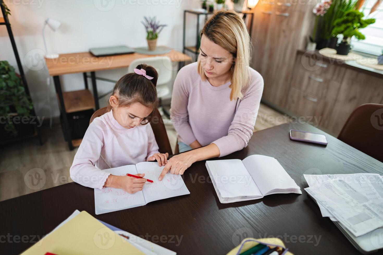 Working together on homework in a cozy study space with flowers photo