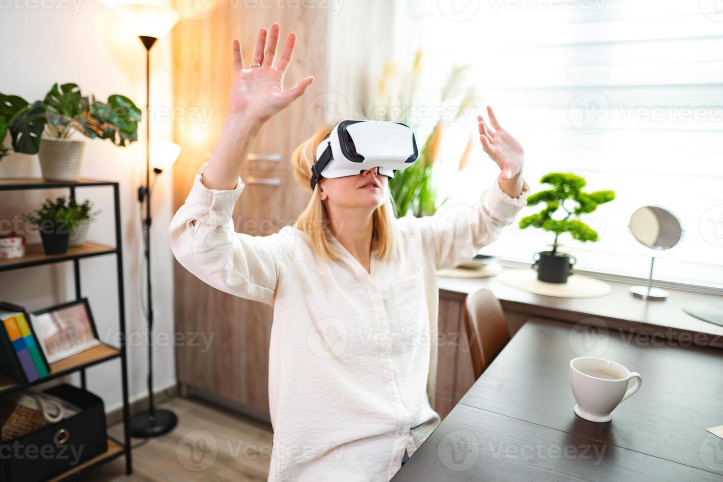 Exploring virtual realities in a cozy home environment with immersive technology photo