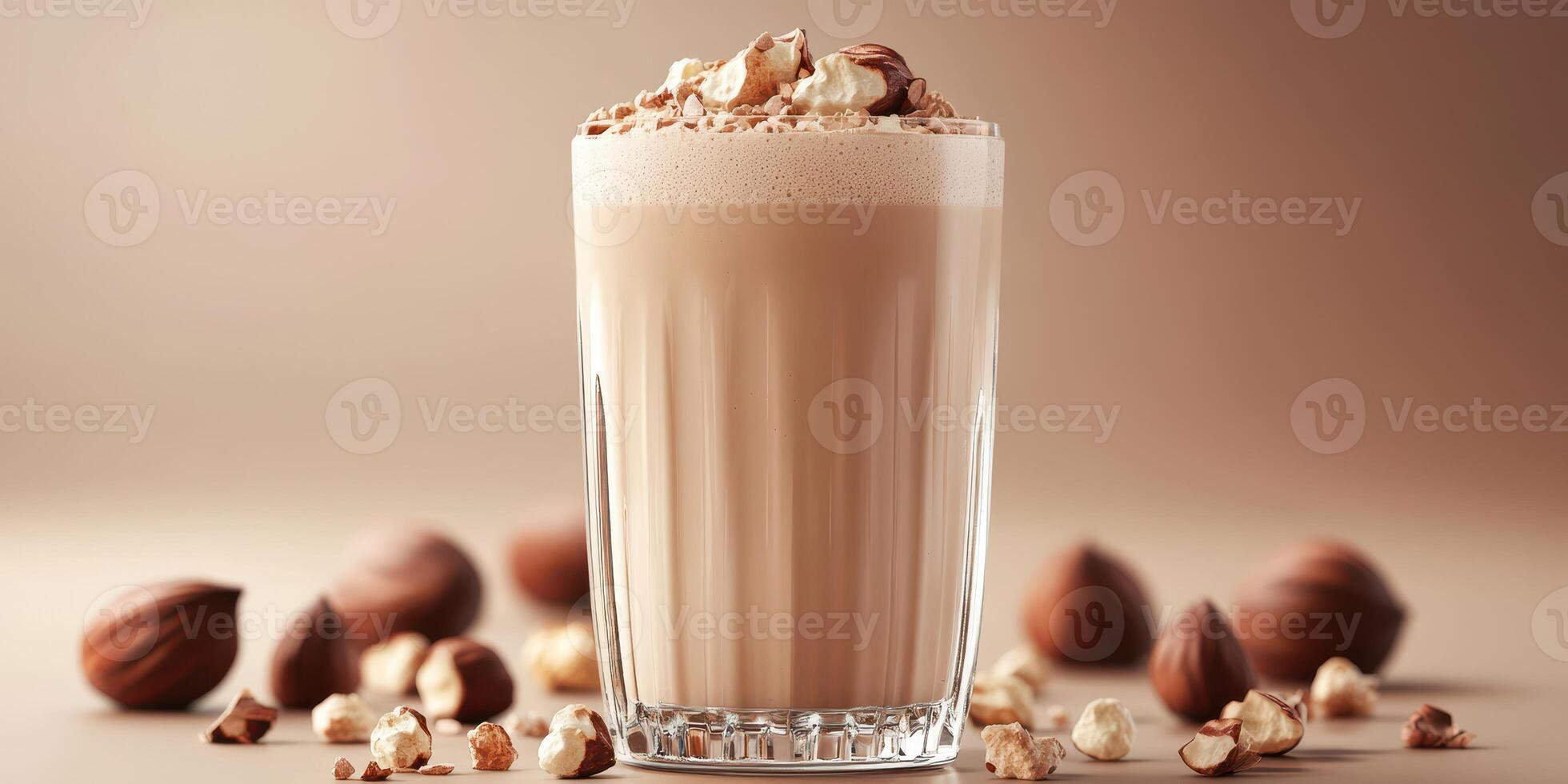 Creamy chocolate beverage topped with nuts served in a glass on a neutral background photo