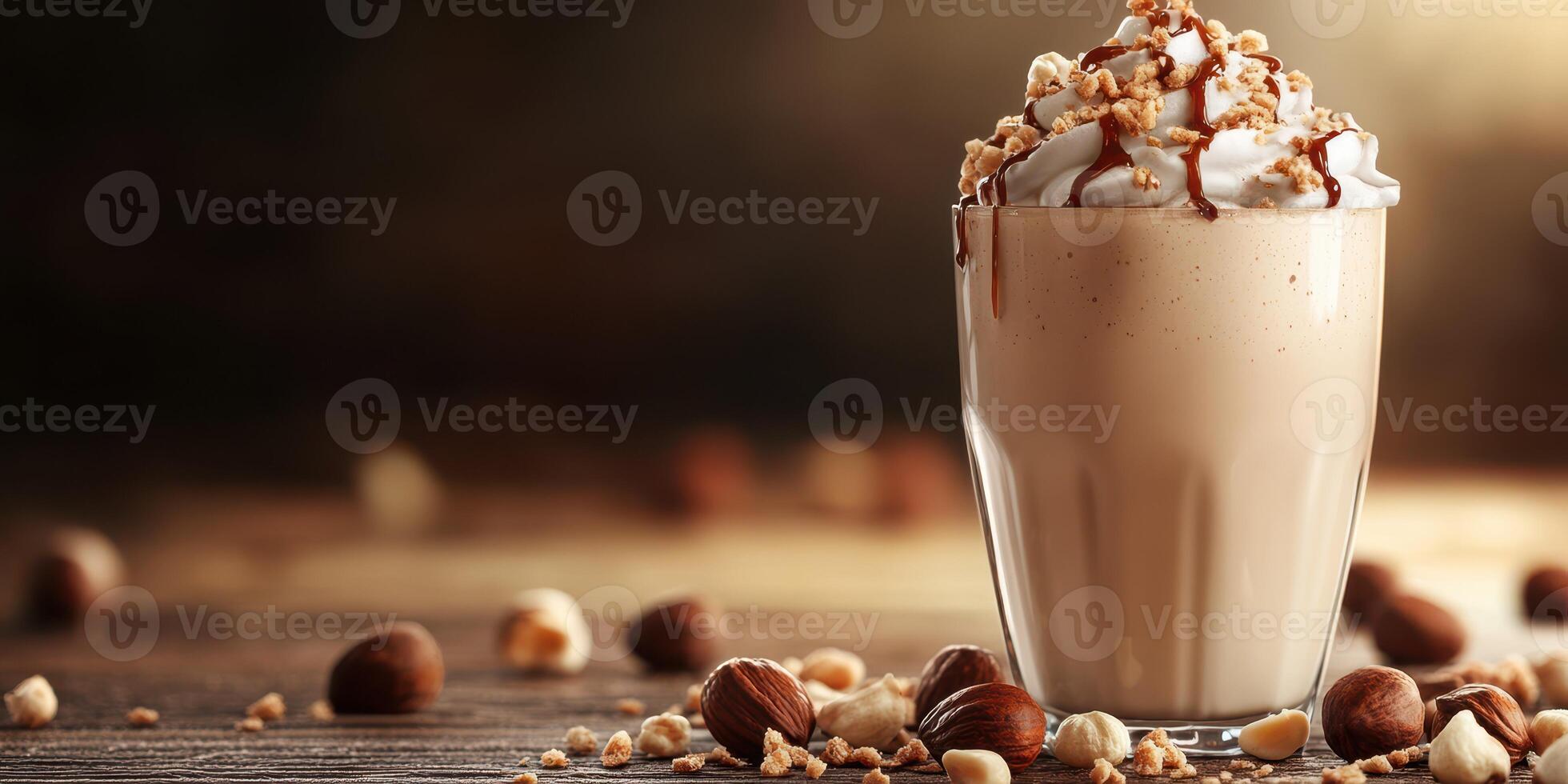 Creamy hazelnut drink topped with whipped cream and nuts sits on wooden table in warm light photo