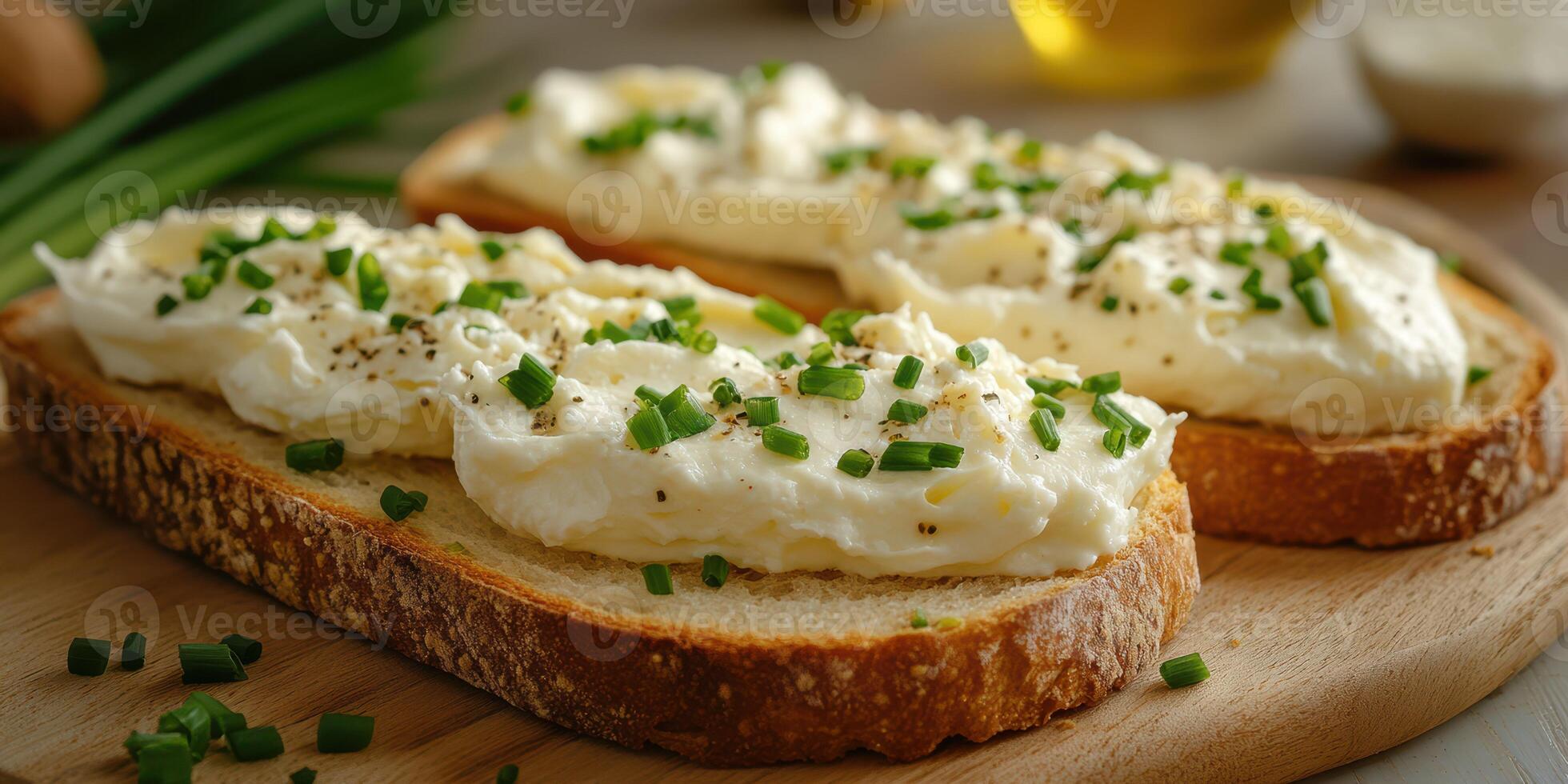Creamy spread on toasted bread garnished with fresh chives in a cozy kitchen setting during afternoon light photo