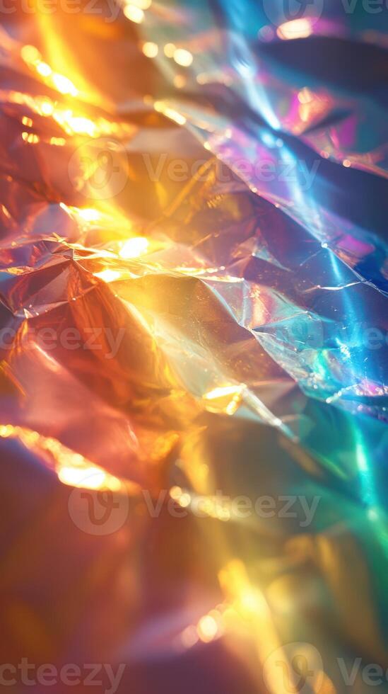 Colorful reflections of light on crumpled foil create an abstract artwork illuminated in darkness photo