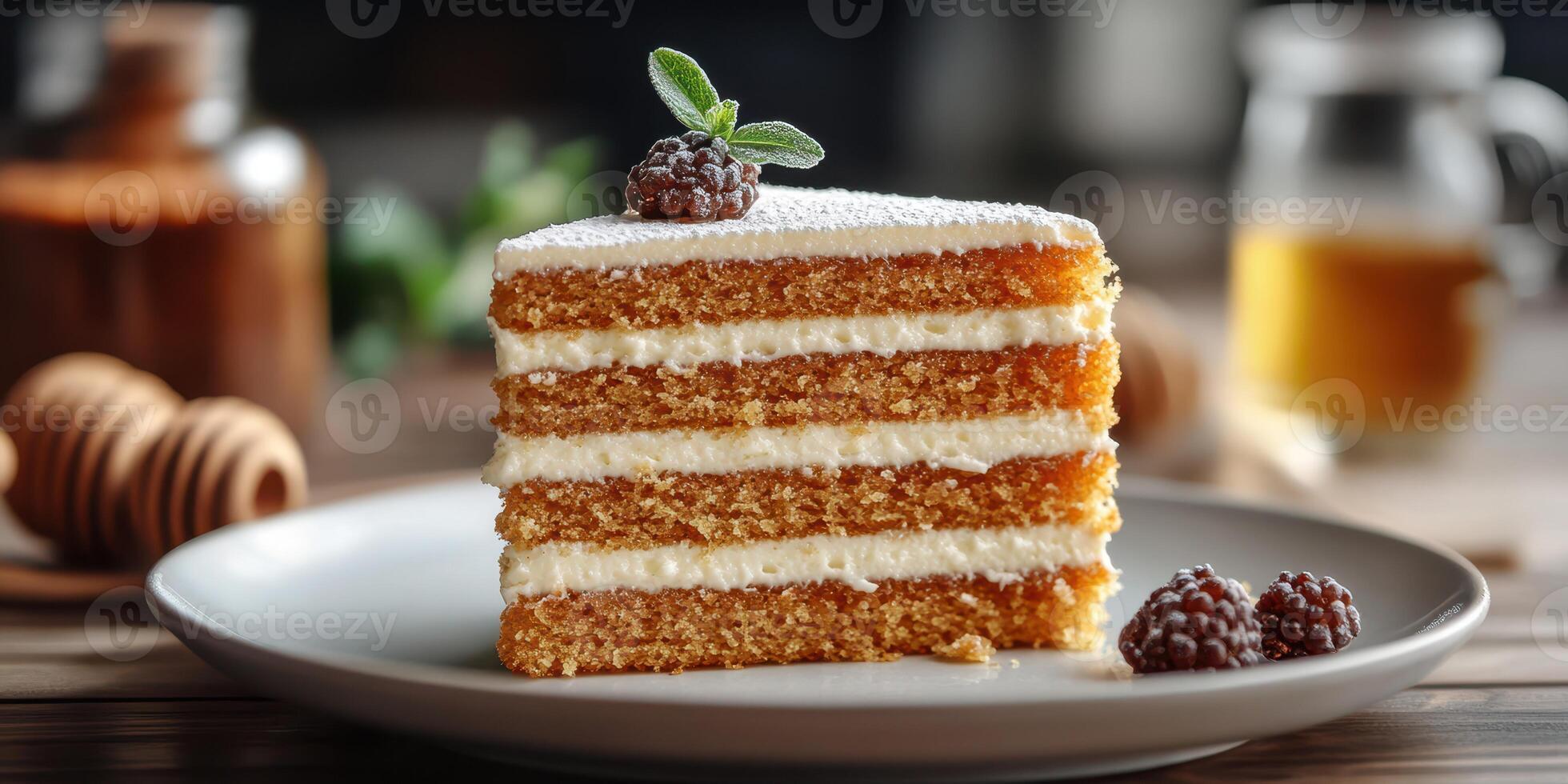 Deliciously layered cake with cream frosting and berries garnished on a rustic wooden table photo
