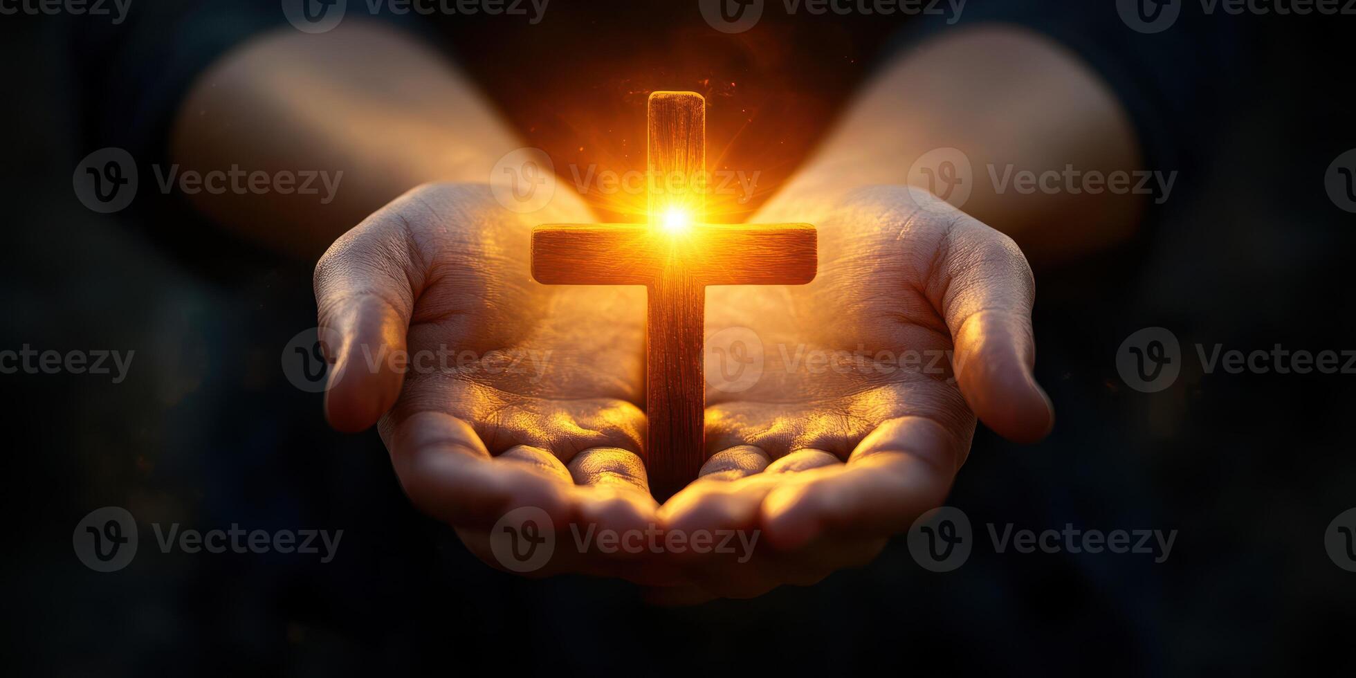 Illuminated cross held by hands symbolizes faith and hope during a spiritual moment at dusk photo