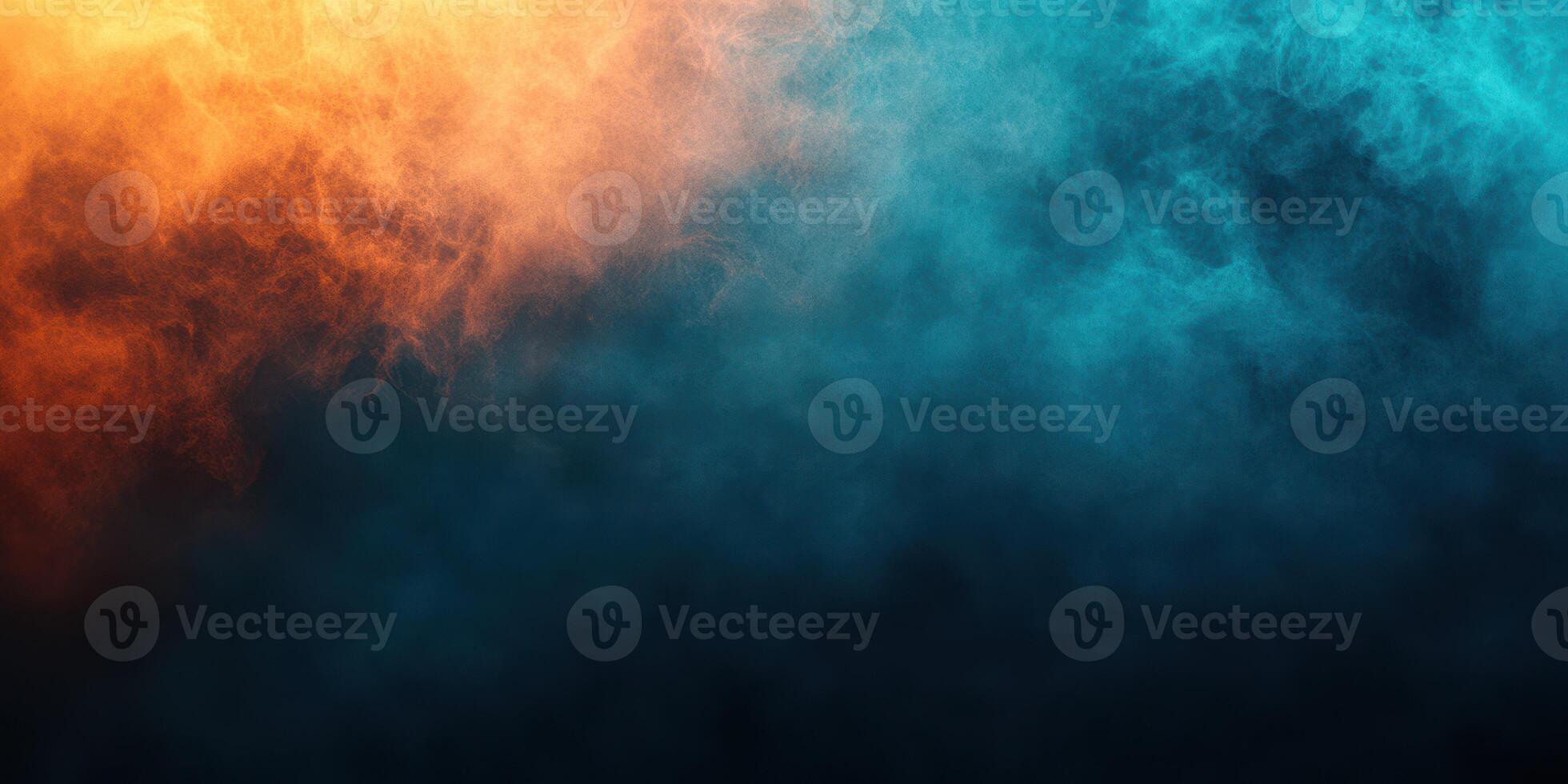 Colorful smoke swirling in vibrant shades of orange and blue creates a dramatic background at dusk photo