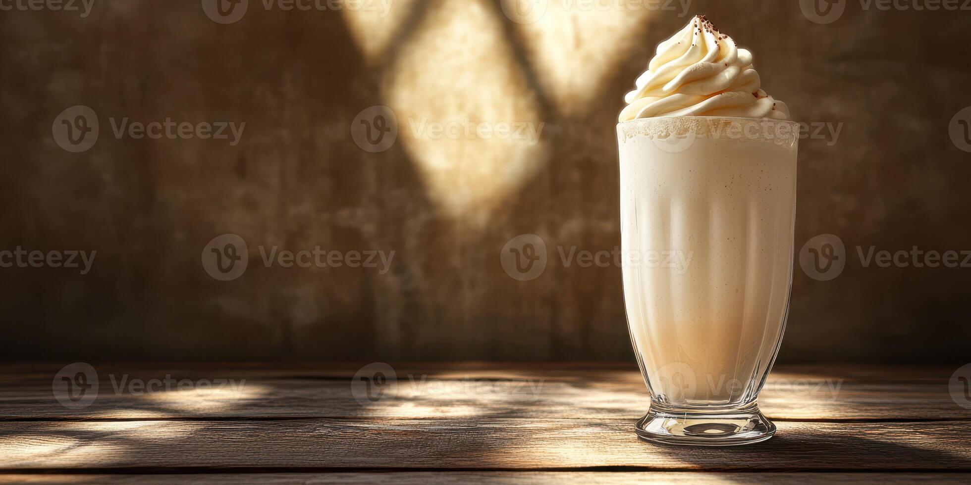 Creamy milkshake served in a classic glass on a wooden table with warm sunlight filtering through photo