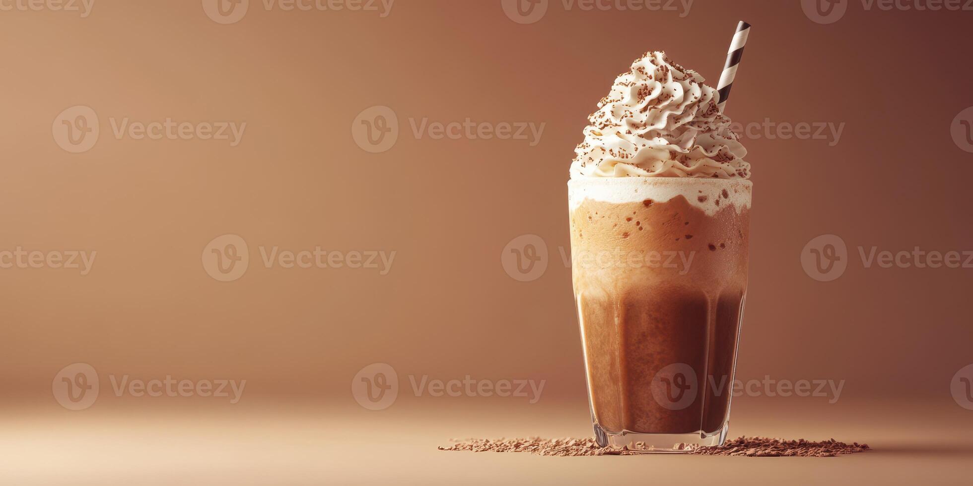 Creamy iced coffee topped with whipped cream and chocolate served in a tall glass on a smooth surface photo