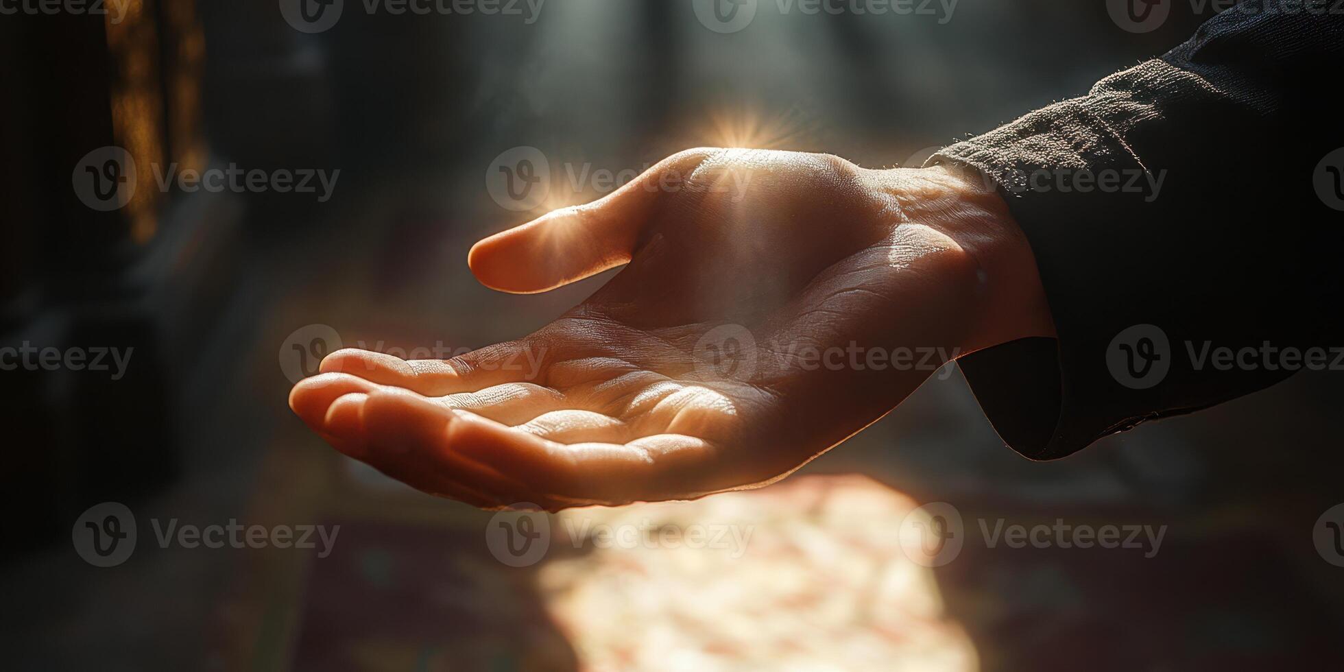 Hand reaching out with glowing energy in a mystical setting during twilight hours photo