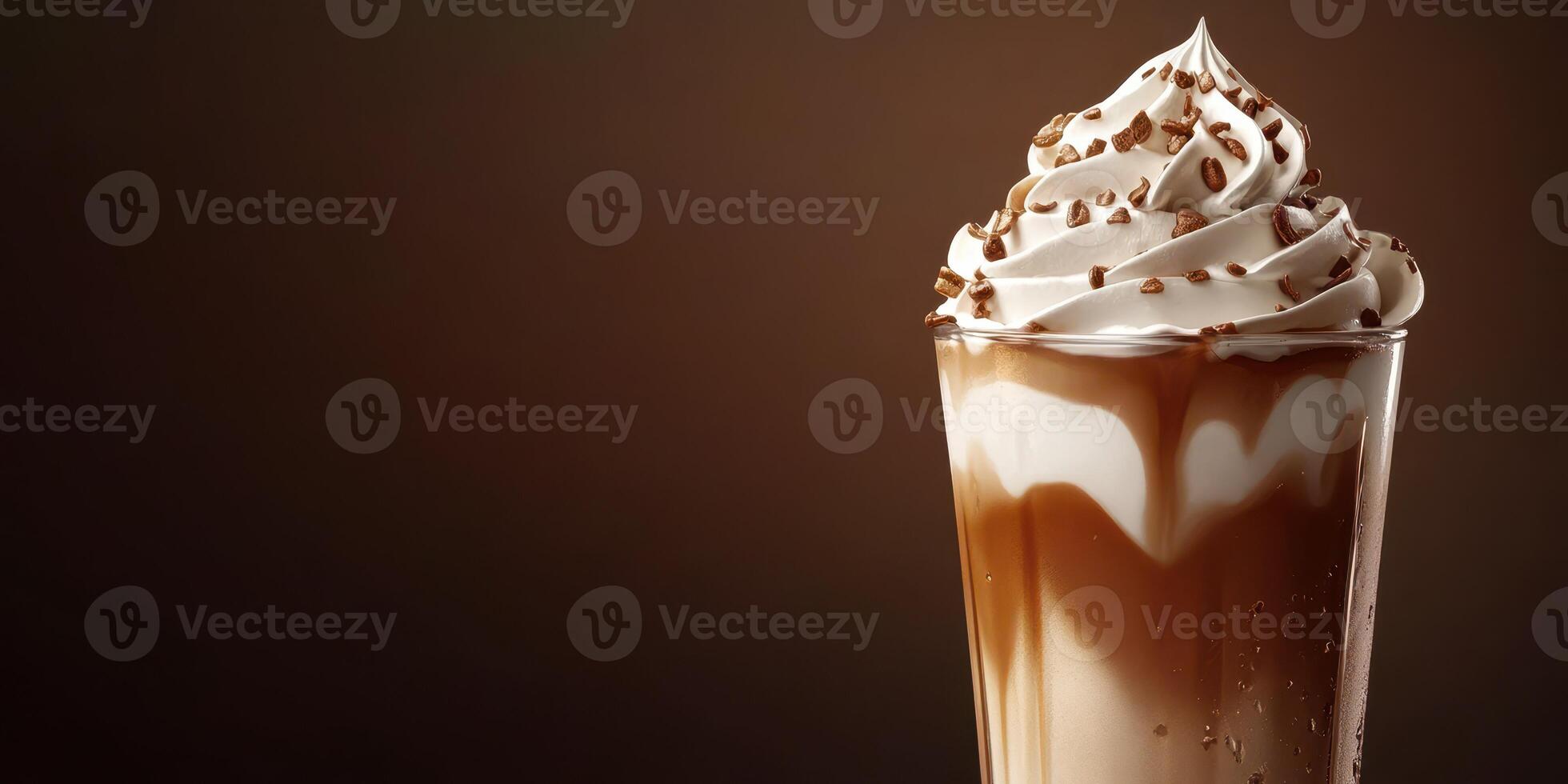 Delicious chocolate milkshake topped with whipped cream and chocolate sprinkles in a glass photo