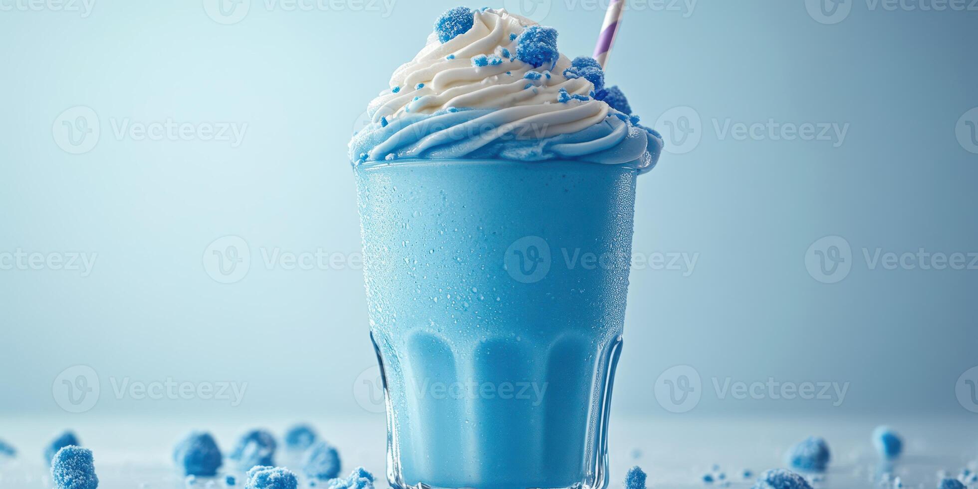 Creamy blue beverage with whipped topping and sprinkles served in a glass on a light background photo