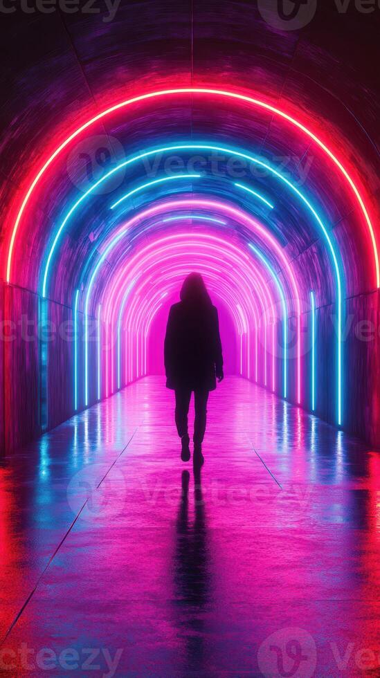 Walking through a vibrant neon tunnel illuminated with colorful lights at night in an urban setting photo