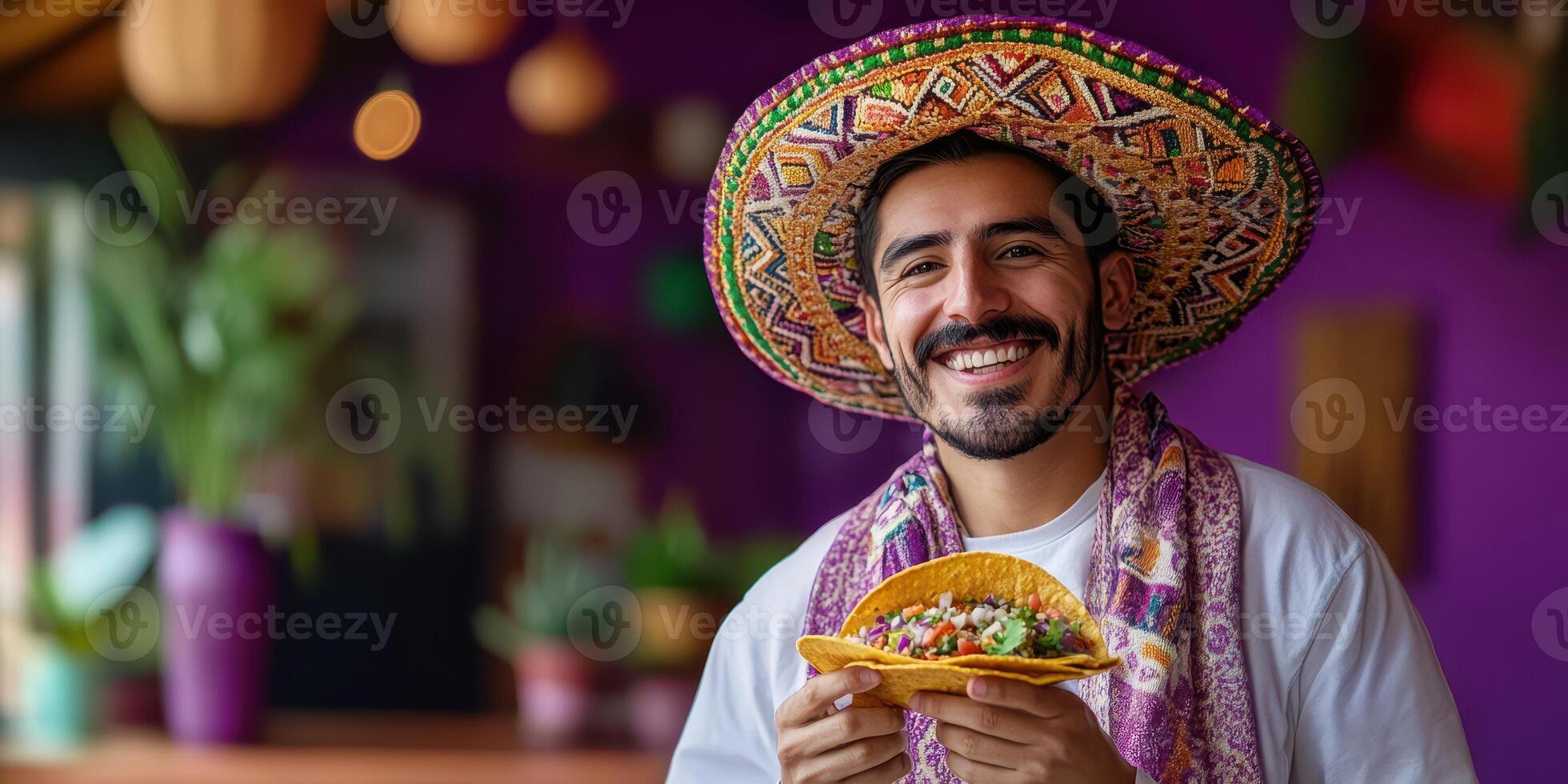 Man in colorful sombrero enjoys taco in vibrant restaurant setting full of plants and warm lighting photo