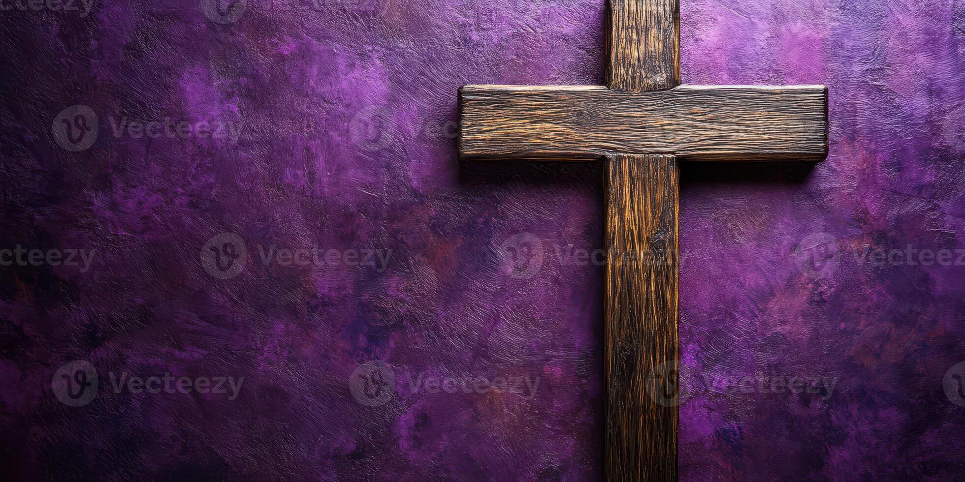 Wooden cross on a textured purple background during a religious ceremony photo