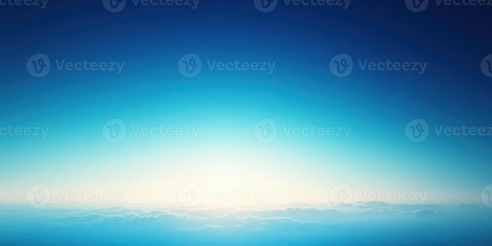 Sunrise over calm ocean landscape with vibrant blue sky and soft clouds photo