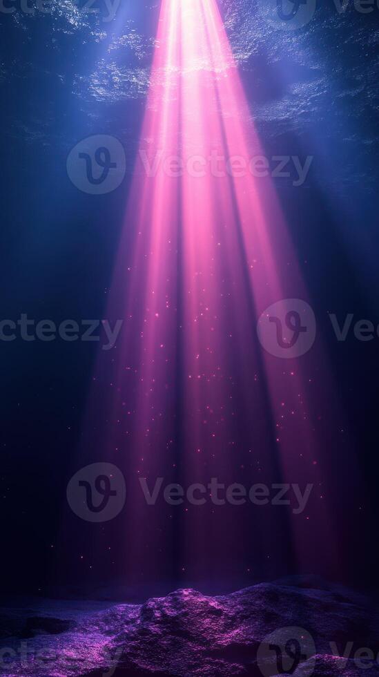 Vibrant underwater light beams create an enchanting atmosphere in a deep ocean setting photo