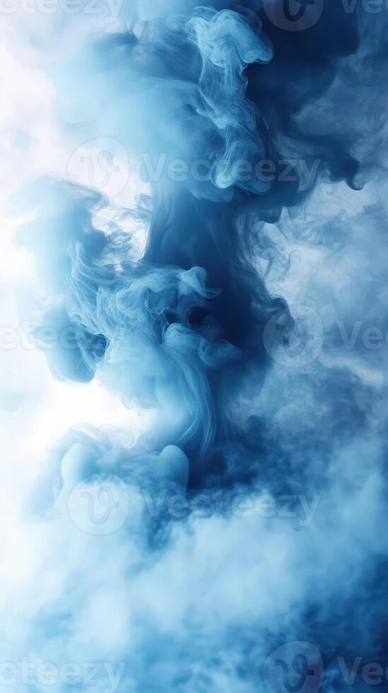 Swirling blue smoke creates an ethereal atmosphere in a dreamy, abstract background suitable for various creative projects photo