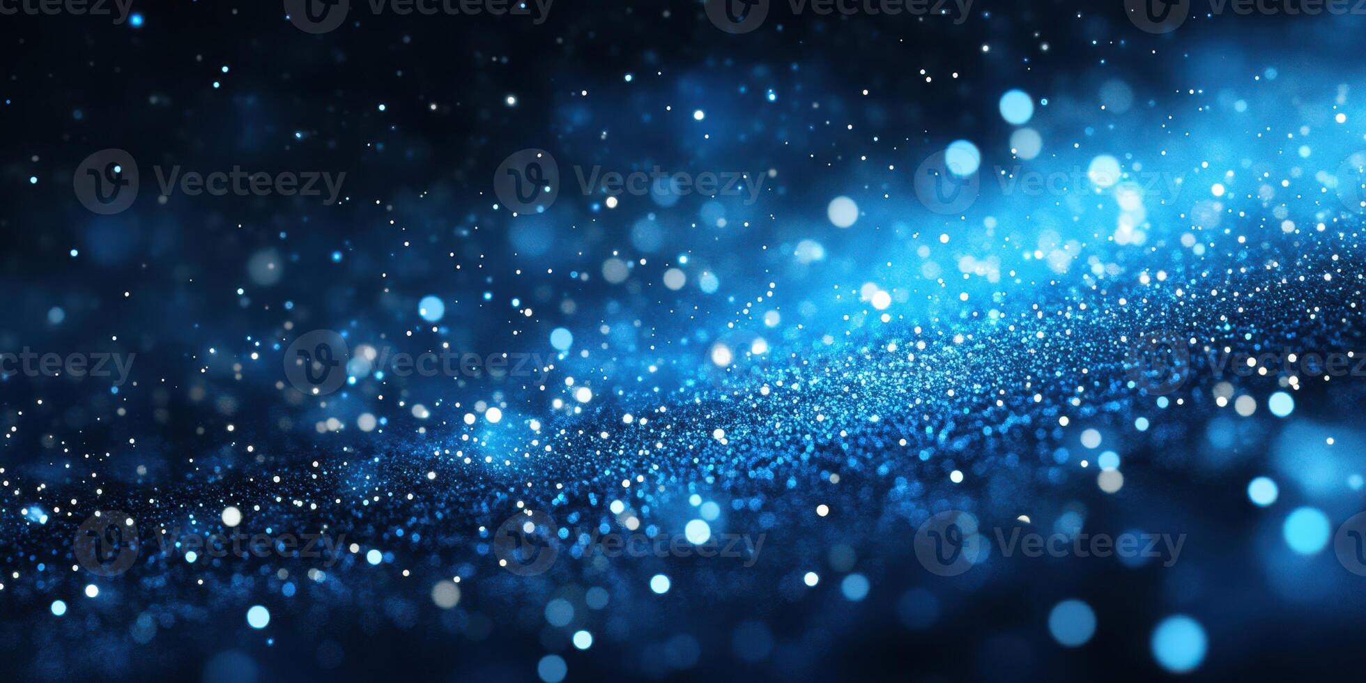 Sparkling blue particles create a magical atmosphere in a dark setting during a nighttime celebration photo