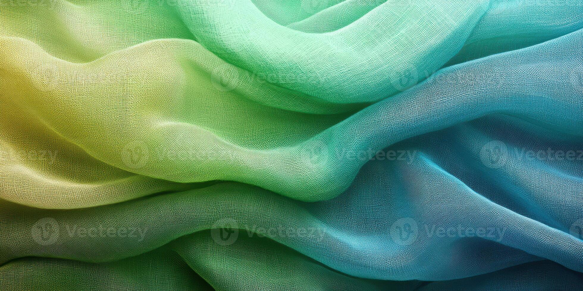 Delicate layers of fabric drape softly in shades of green and blue, creating a tranquil visual experience in natural light photo