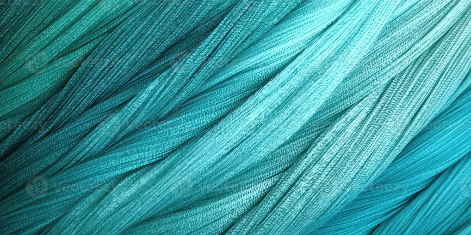 Vibrant teal and aqua threads creating a beautiful gradient pattern in a textile design photo