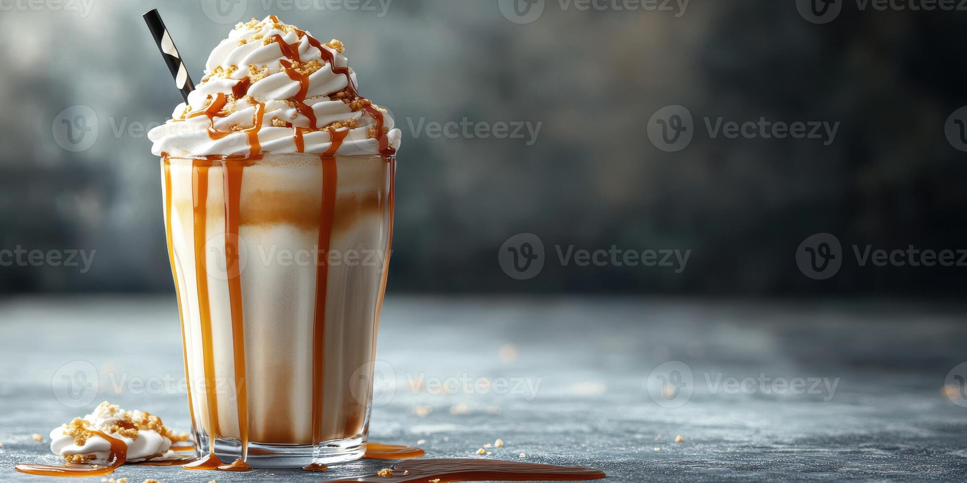 Delicious caramel milkshake topped with whipped cream and drizzled with syrup on a rustic table photo