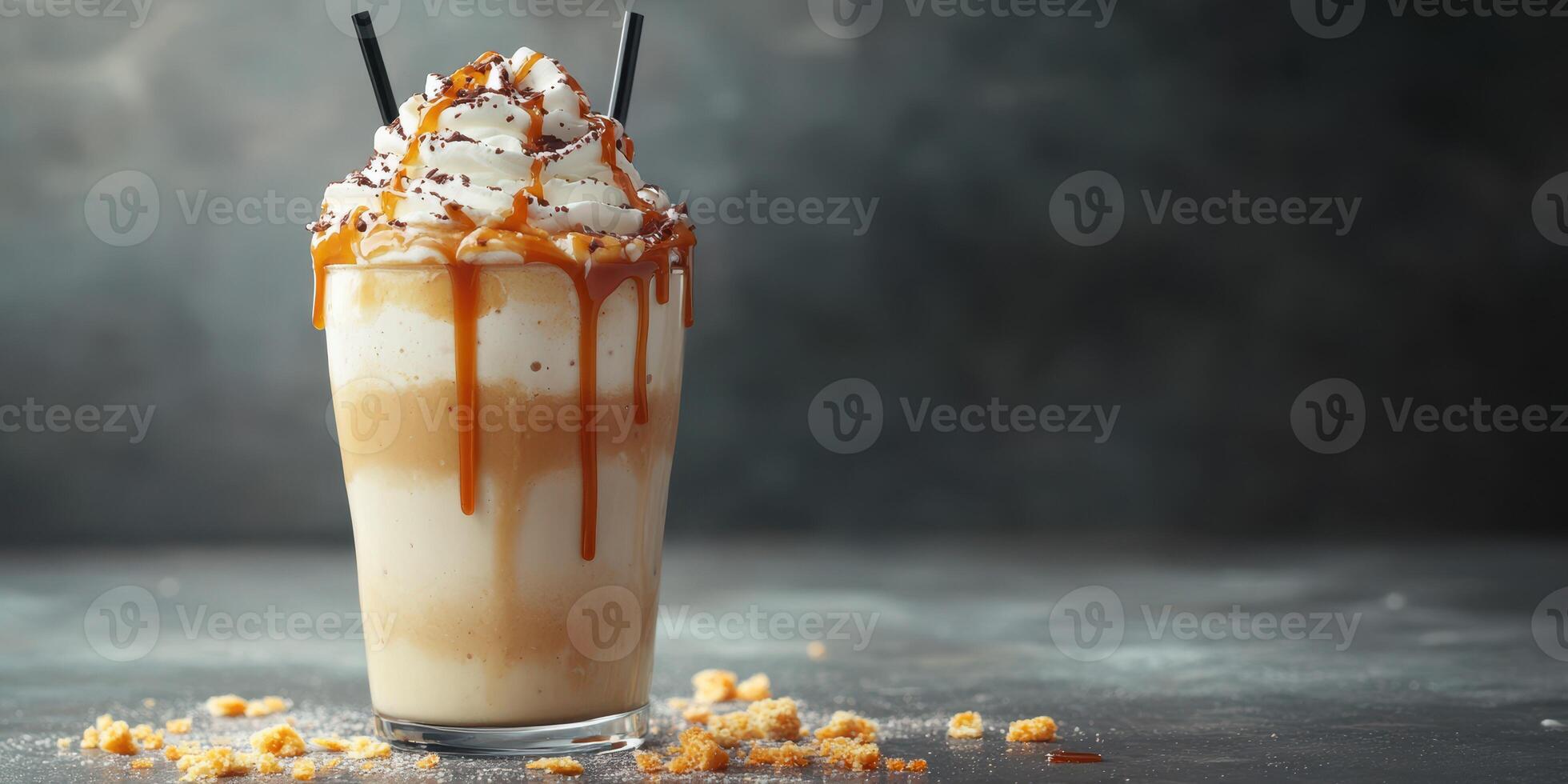 Delicious caramel and whipped cream dessert drink is served in a tall glass with chocolate sprinkles and crunchy bits photo