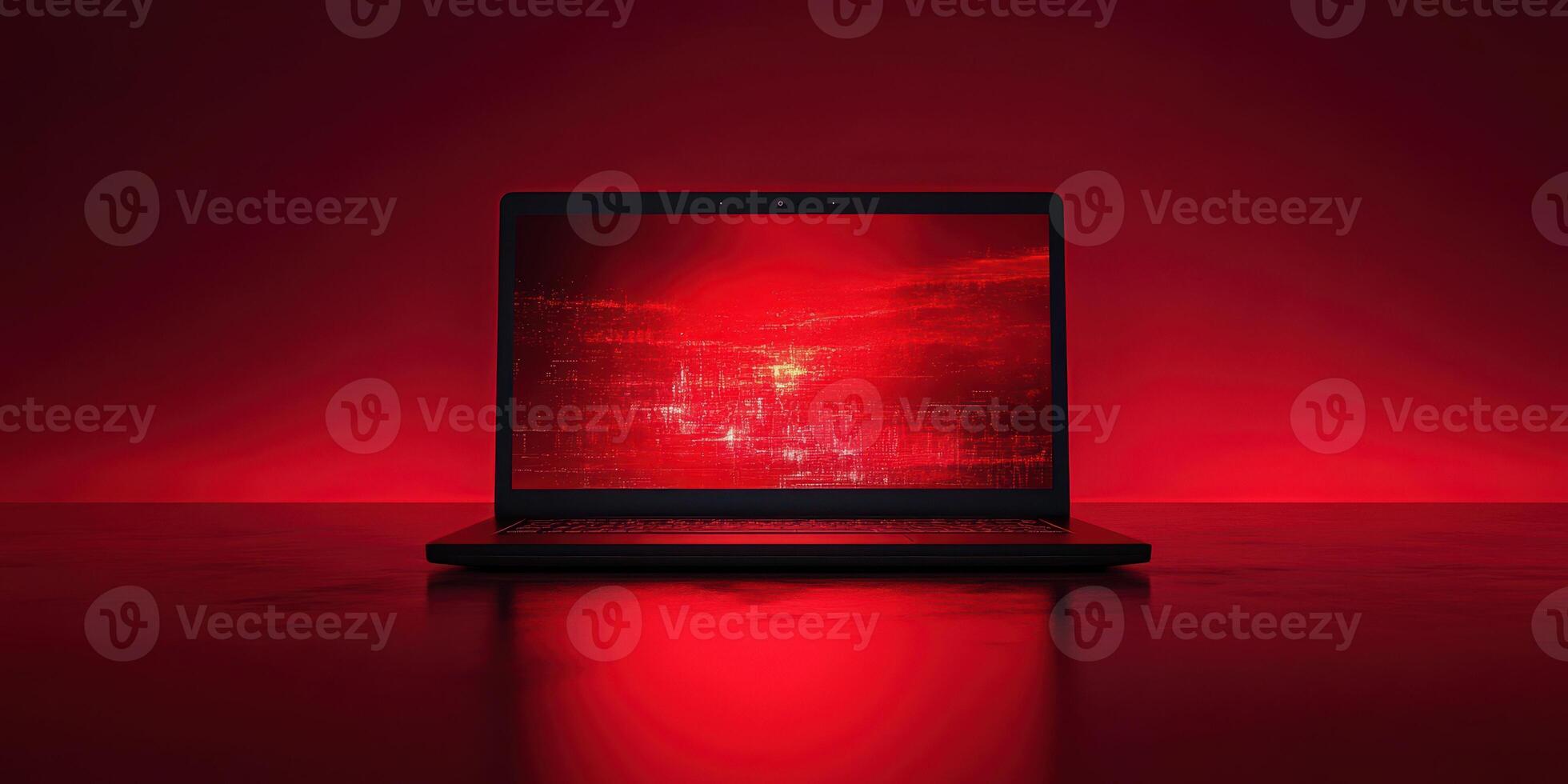 Computer screen glowing red in a dark environment creates an intense and dramatic atmosphere for tech enthusiasts photo