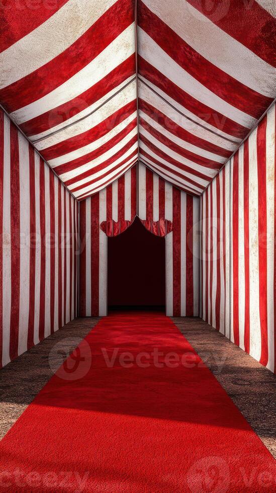 Striped tent entrance with red carpet leading into dark space at a circus or fair setting photo