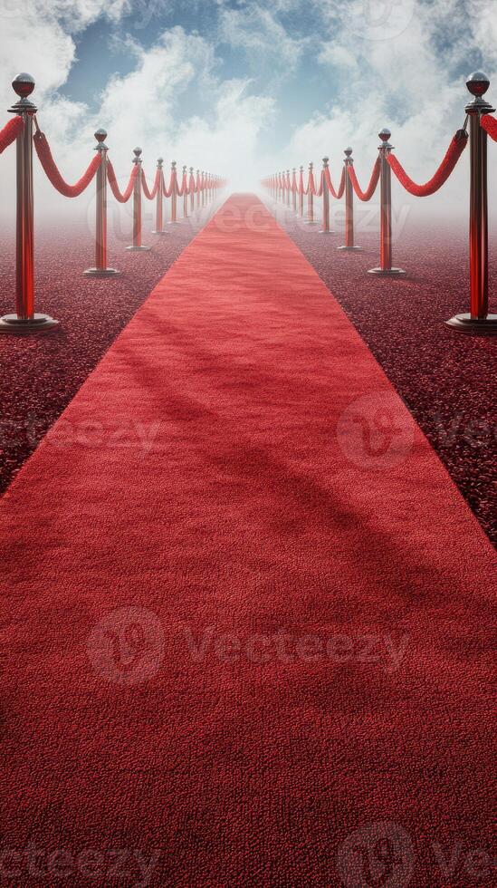 Red carpet leading to a bright light with velvet ropes and polished stanchions at an outdoor event in the daytime photo