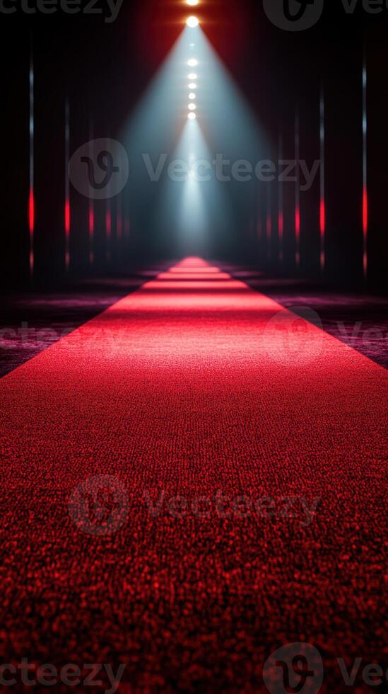 Red carpet leading to a spotlight in a dimly lit corridor during an exhibition or event photo