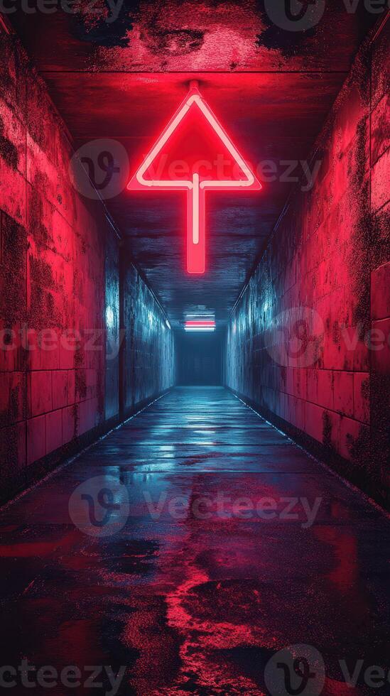 Neon arrow illuminates a dimly lit hallway in a modern urban setting at night photo