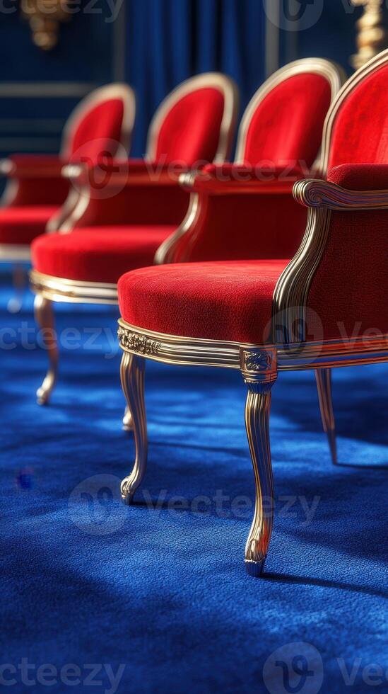 Elegant red chairs arranged on a vibrant blue carpet in an opulent interior setting with rich colors and textures photo