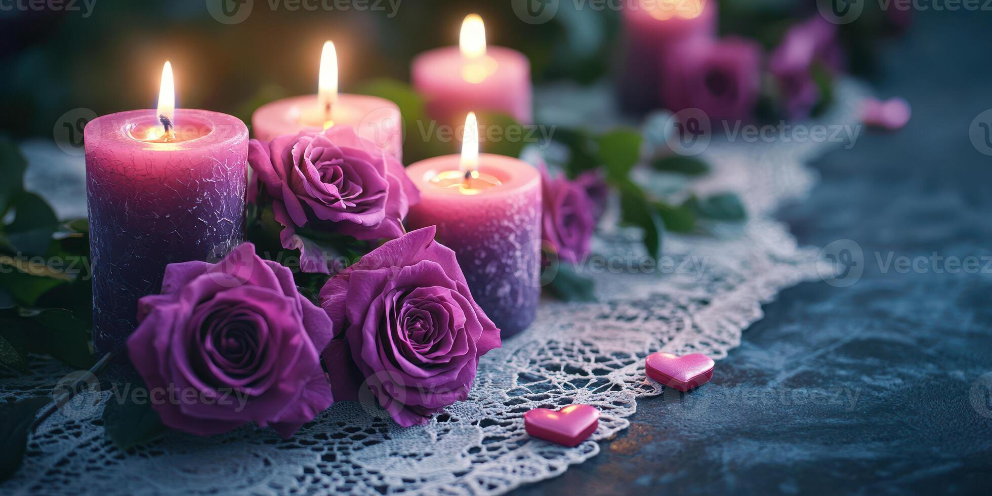 Romantic arrangement of purple candles and roses on lace table setting for a cozy evening photo