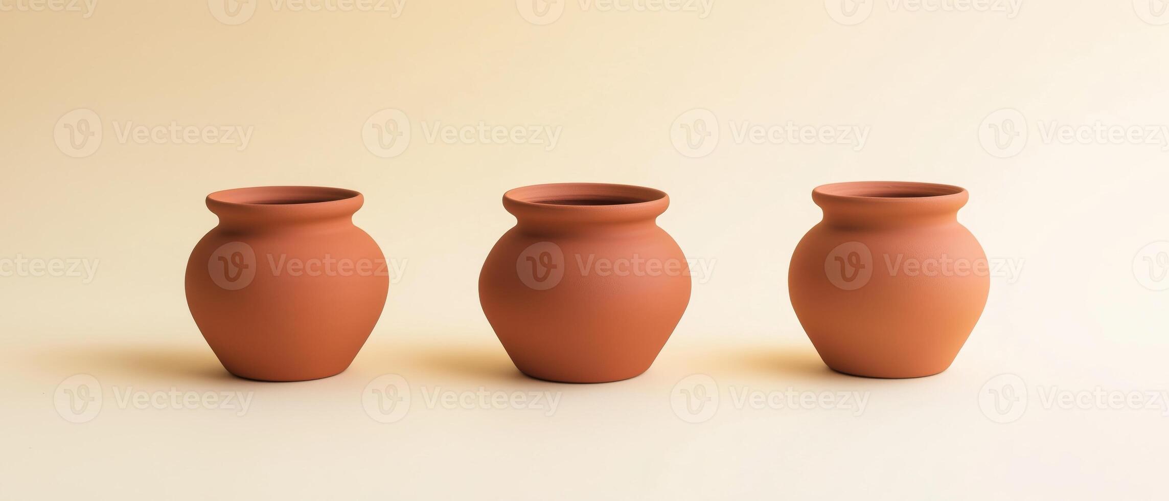 Three Clay Pots on Neutral Background photo