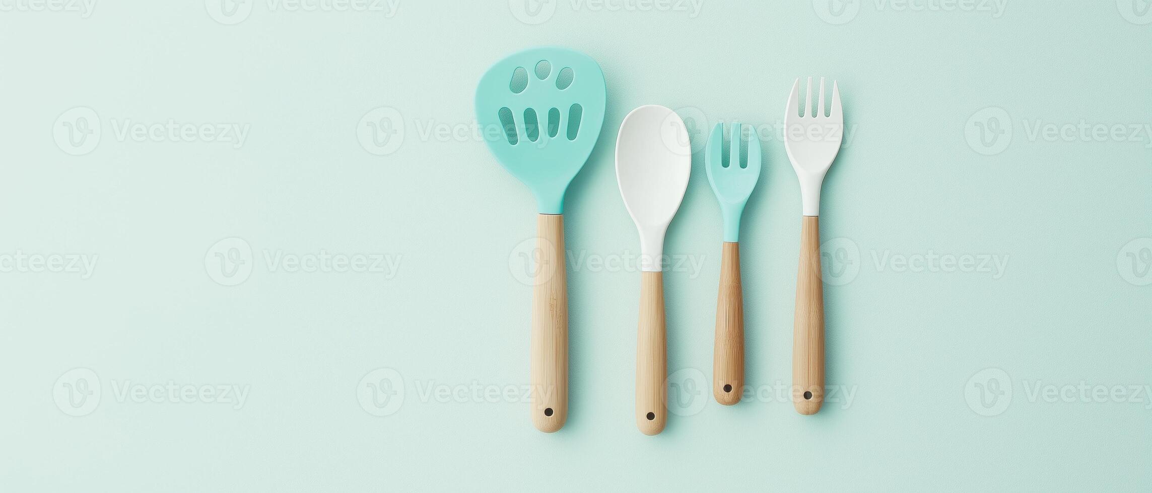Silicone Kitchen Utensils On Pastel Background photo