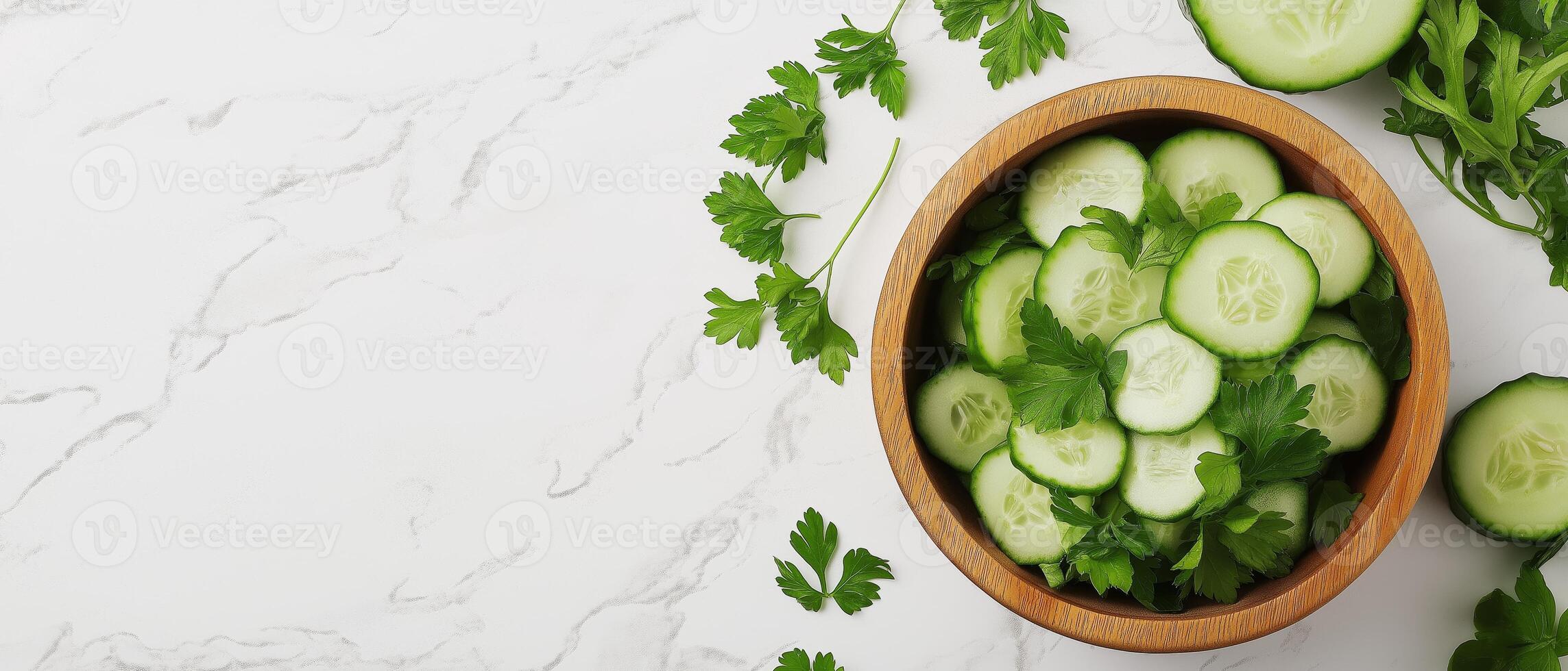 Sliced Cucumbers And Parsley In Bowl photo