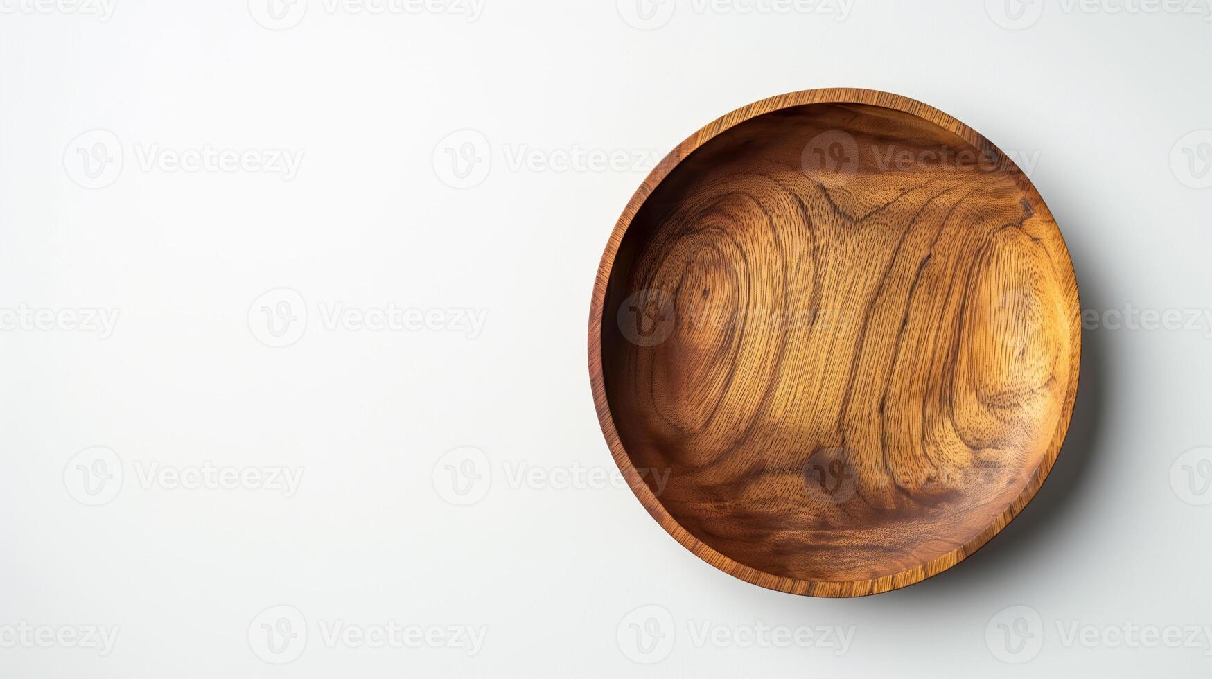 Wooden bowl on white background photo