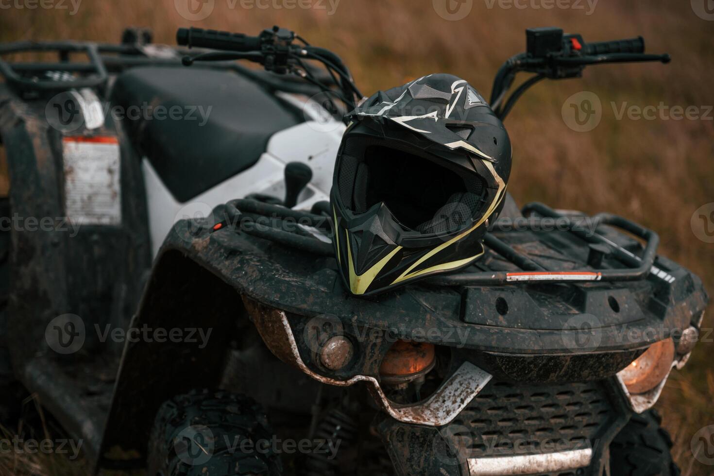Close up view of ATV quad bike with protective helmet on it photo