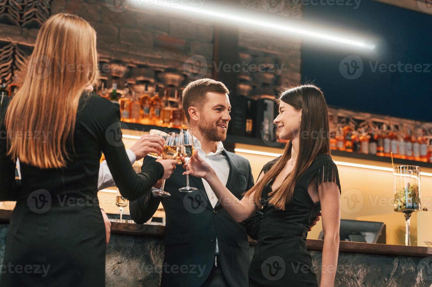 Group ,of people standing with glasses and celebrating event together photo