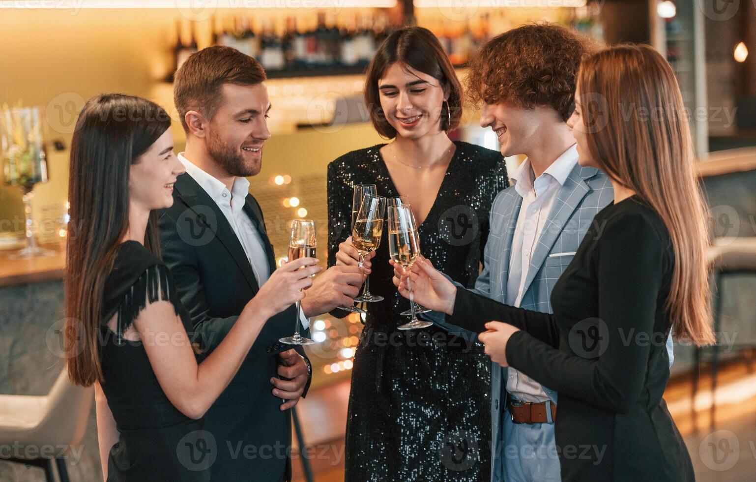 Conception ,of celebrating ,event. Group of people in elegant clothes are in the restaurant photo