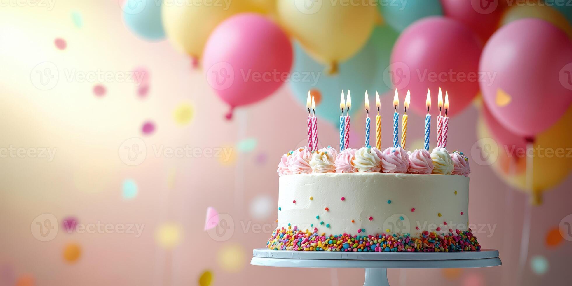 Colorful birthday cake with candles and balloons in festive celebration atmosphere photo