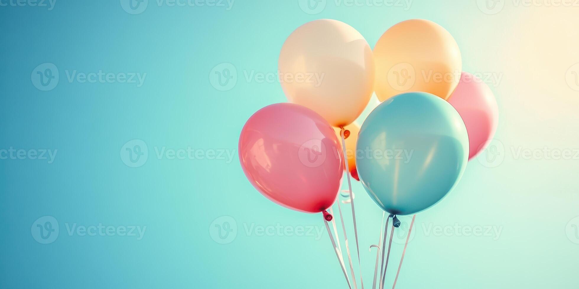 Colorful balloons floating against a bright blue sky create a joyful atmosphere for any celebration or event photo