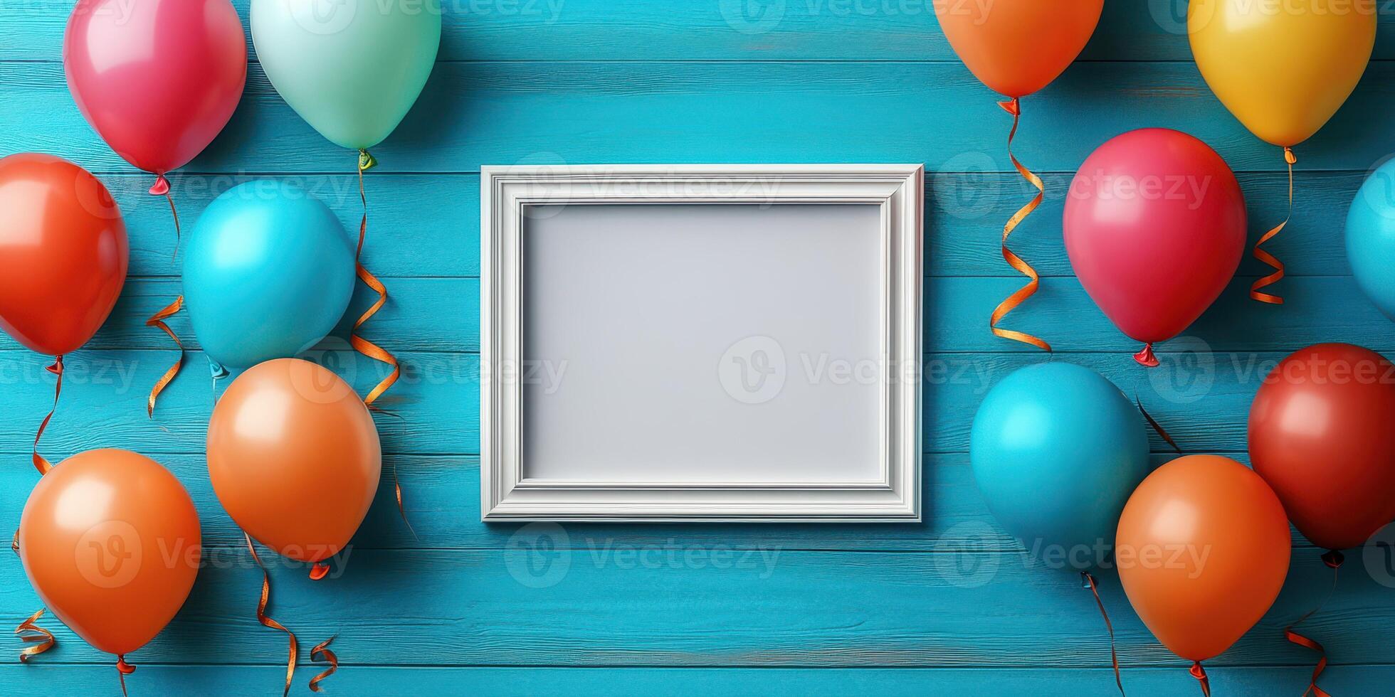 Colorful balloons surround an empty frame on a blue wooden background for a festive celebration photo