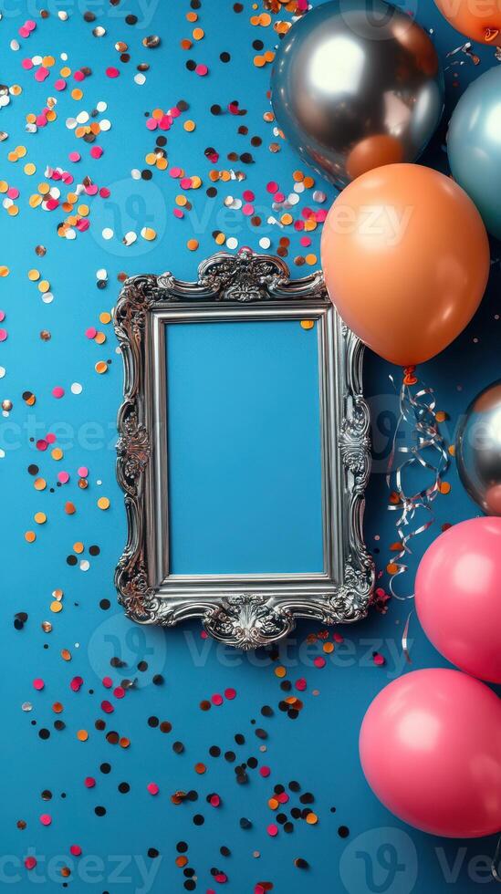 Colorful balloons and confetti surround an empty ornate frame against a vibrant blue background for a festive celebration photo