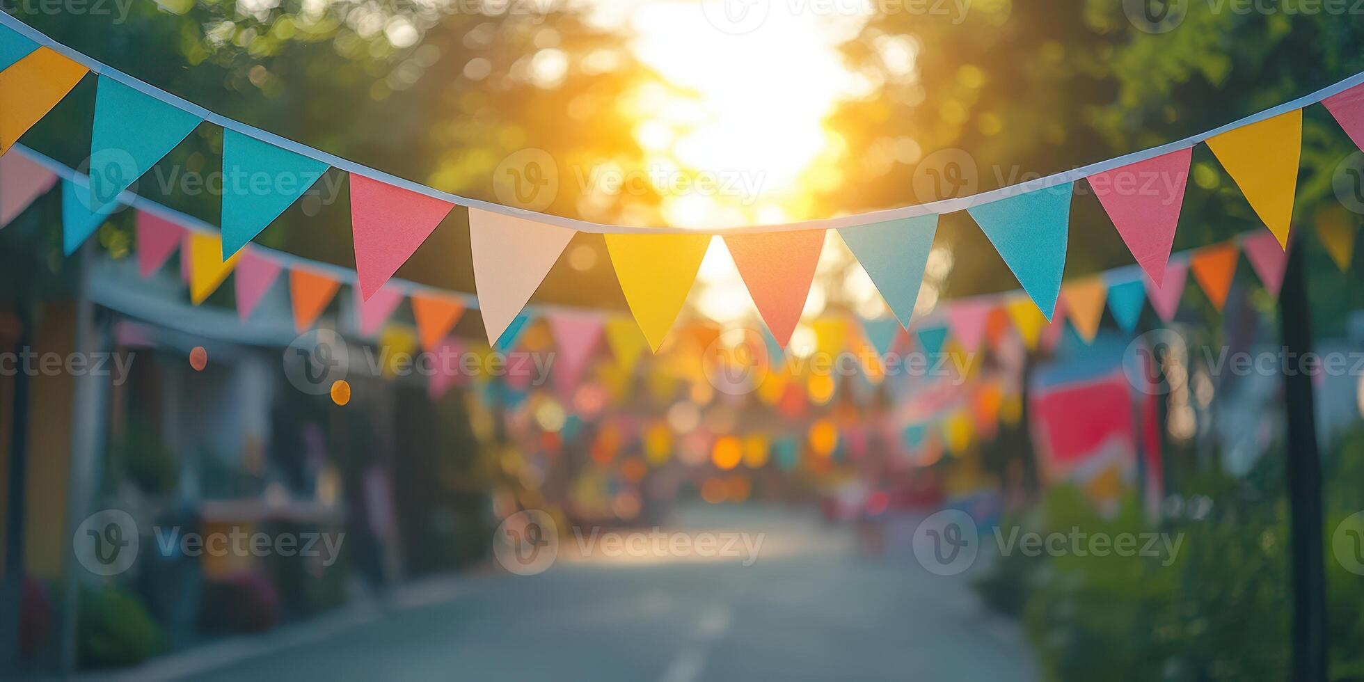 Colorful festive bunting decorates a street during sunset in a vibrant neighborhood celebration photo